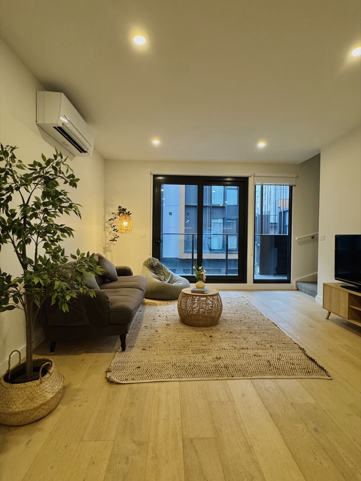 Bright, cosy furnished living room in a Melbourne home